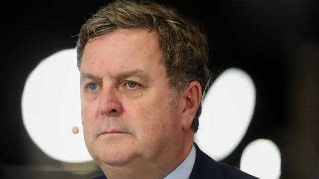 Mel Stride close up picture in front of some lights