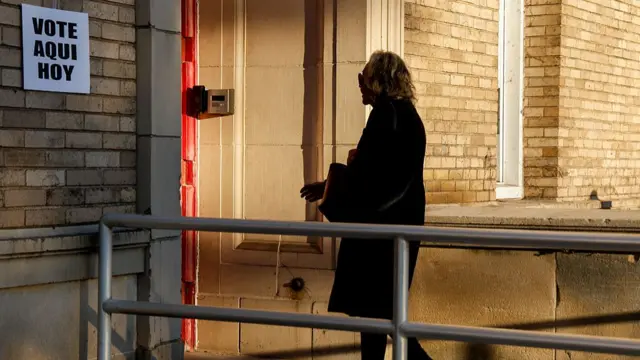 A woman enters a polling place in New Jersey
