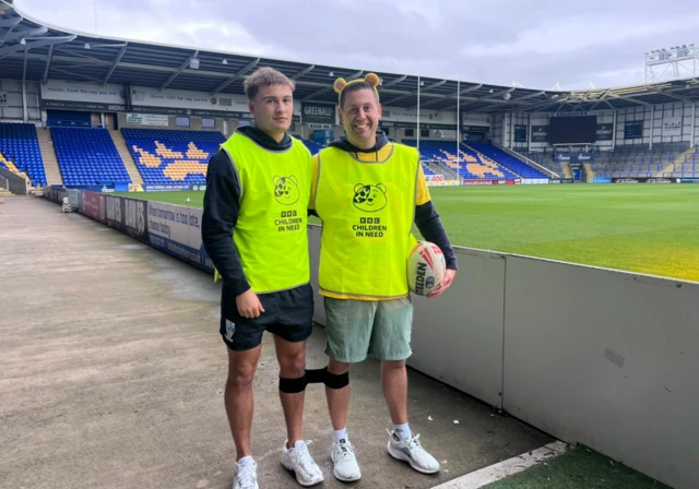 Phil Munns with fullback of Warrington Wolves Cai Taylor-Wray