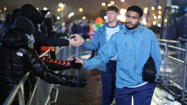 Coventry City players high five fans as they arrive at the CBS Arena
