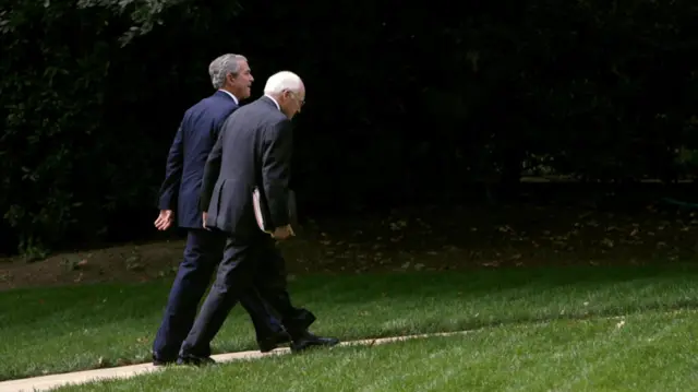President Bush and Vice-President Cheney walk back to the Oval Office on 1 October, 2007