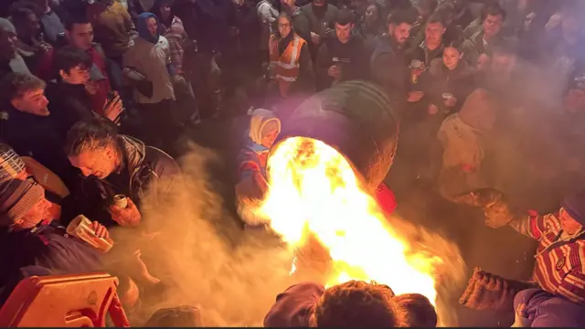 A flaming tar barrel