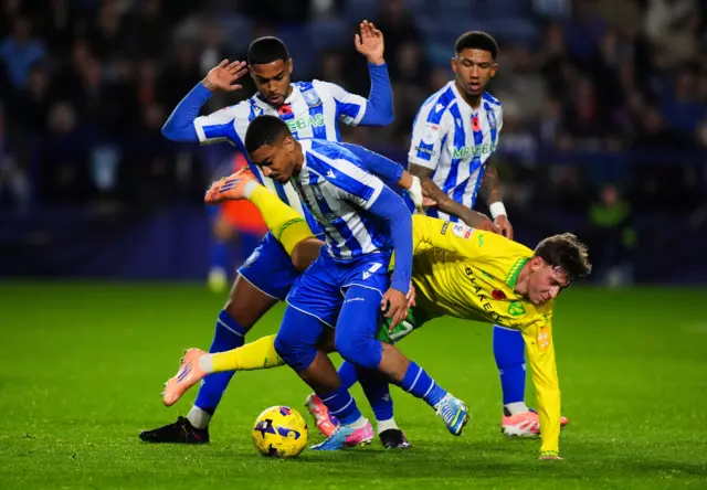 Norwich City's Oscar Schwartau and Sheffield Wednesday's Yan Valery battle for the ball