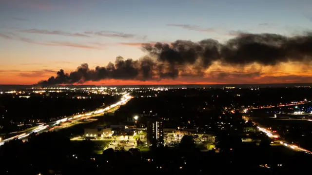 Smoke rises from the site of a UPS cargo plane crash near the UPS Worldport at Louisville Muhammad Ali International Airport in Louisville