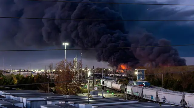 Smoke rises from the wreackage of a UPS MD-11 cargo jet after it crashed on departure from Louisville Muhammad Ali International Airport