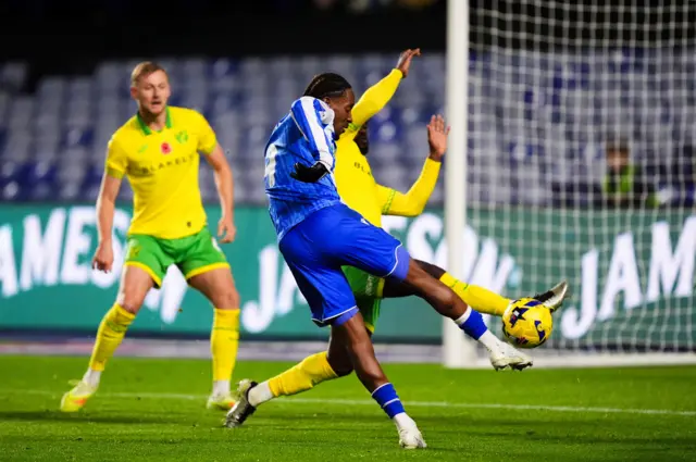 Sheffield Wednesday's Jamal Lowe has a shot blocked