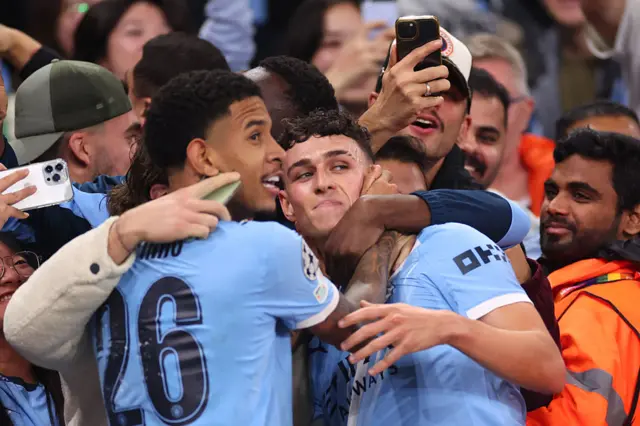 Phil Foden with supporters after goal