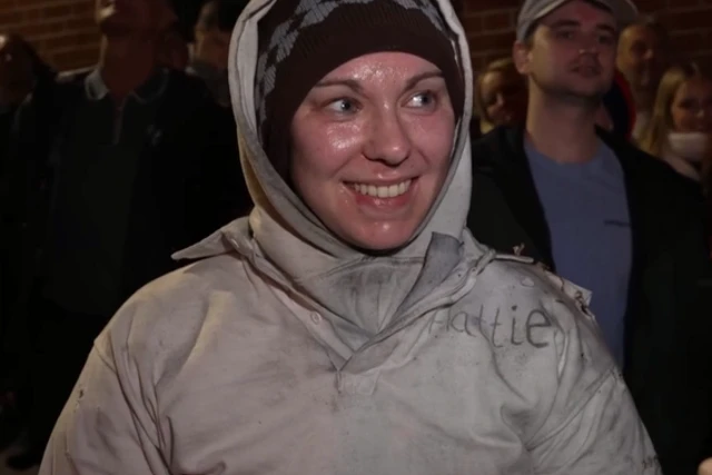 Hattie smiling at the camera.