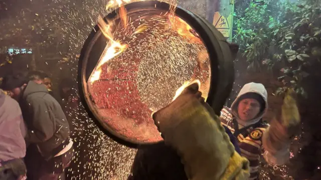 A flaming tar barrel