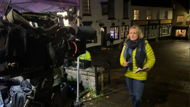 Victoria Graham stood in front of a camera getting ready to go live.