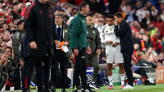 Xabi Alonson talks to Trent Alexander-Arnold before sending him on