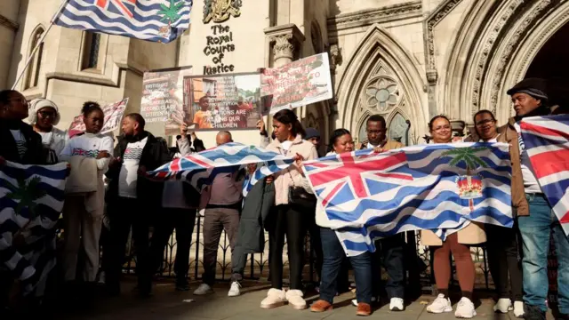 People protest outside the High Court where Chagossian campaigners are challenging the British government's deal to transfer sovereignty of the Chagos Islands to Mauritius, in London, Britain