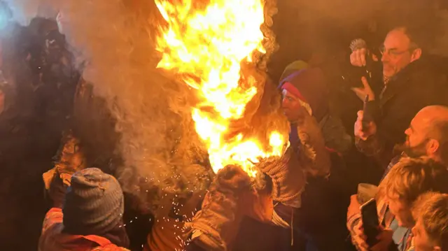 A flaming tar barrel