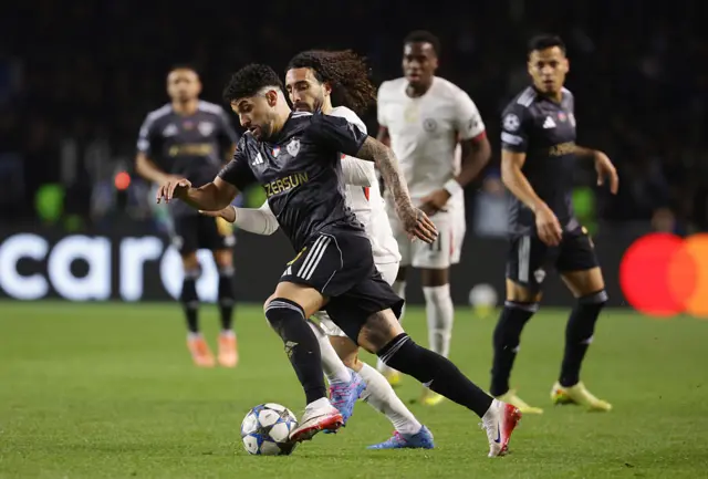Kady Borges of Qarabag is challenged by Marc Cucurella
