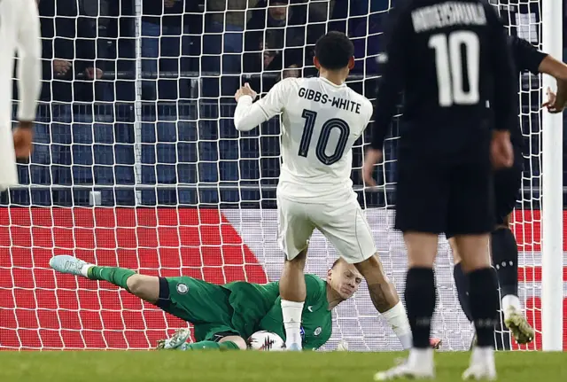 Sturm Graz's Danish goalkeeper #01 Oliver Christensen saves the ball from Nottingham Forest's English midfielder #10 Morgan Gibbs-White during the UEFA Europa League football match between SK Sturm Graz and Nottingham Forest FC in Graz, Austria on November 6, 2025.