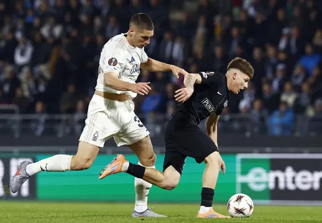 Nottingham Forest's Serbian defender #31 Nikola Milenkovic (L) and Sturm Graz's Polish midfielder #08 Filip Rozga vie for the ball during the UEFA Europa League football match between SK Sturm Graz and Nottingham Forest FC in Graz, Austria on November 6, 2025.