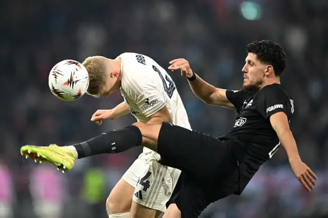 Zach Abbott of Nottingham Forest heads the ball as Emir Kari