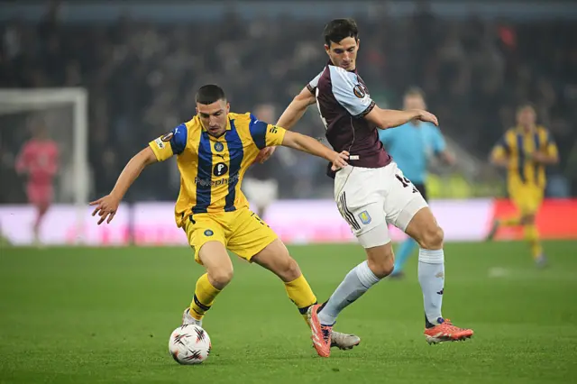 Osher Davida of Maccabi Tel Aviv controls the ball whilst under pressure from Pau Torres of Aston Villa during the UEFA Europa League 2025/26 League Phase MD4 match between Aston Villa FC and Maccabi Tel-Aviv FC at Villa Park on November 06, 2025 in Birmingham, England.