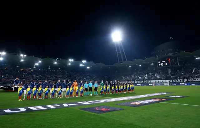 General view as the teams line up before the match