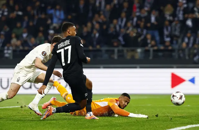 Nottingham Forest's Welsh defender #03 Neco Williams, Sturm Graz's German forward #77 Maurice Malone and Nottingham Forest's Brazilian goalkeeper #13 John Victor vie for the ball during the UEFA Europa League football match between SK Sturm Graz and Nottingham Forest FC in Graz, Austria