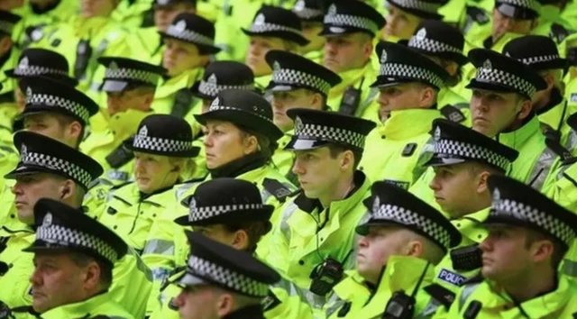 Dozens of uniformed  male and female Police Scotland officers
