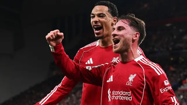 lexis Mac Allister of Liverpool celebrates scoring his team's first goal with teammate Hugo Ekitike