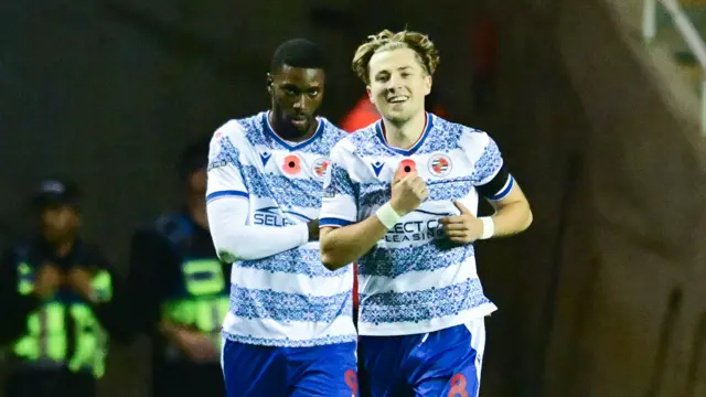 Reading midfielder Charlie Savage (8) scores a goal and celebrates with Reading forward Kelvin Ehibhatiomhan