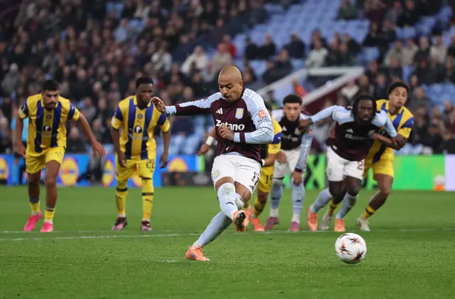 Donyell Malen of Aston Villa scores a penalty