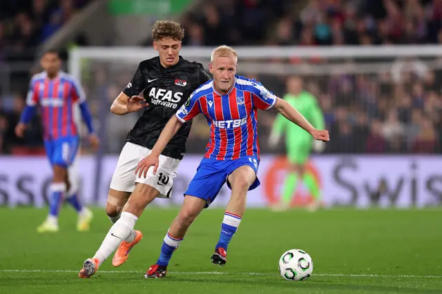 Will Hughes of Crystal Palace looks to control the ball whilst under pressure from Sven Mijnans of AZ Alkmaar during the UEFA Conference League 2025/26 League Phase MD3 match between Crystal Palace FC and AZ Alkmaar at Selhurst Park on November 06, 2025 in London, England.