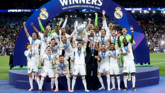 Real Madrid celebrating the victory with the Champions League trophy