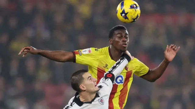 Kevin Keben of Watford wins a header whilst under pressure from Anis Mehmeti of Bristol City
