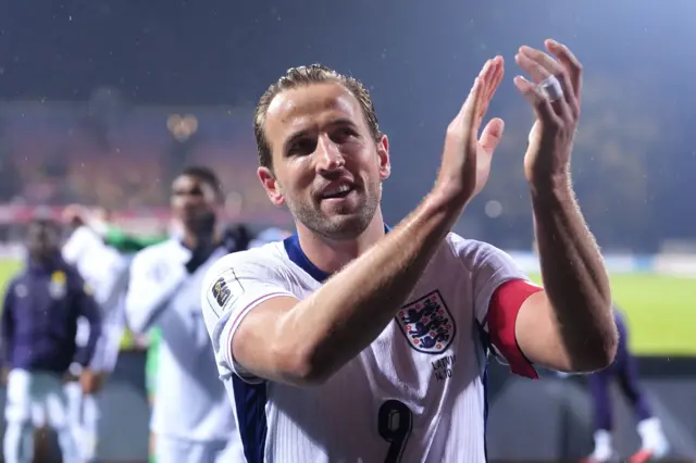 Harry Kane applauds the England fans in Latvia