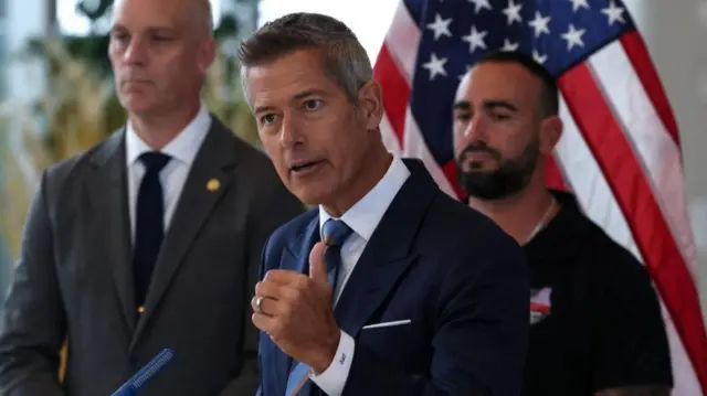 Sean Duffy speaks into a microphone