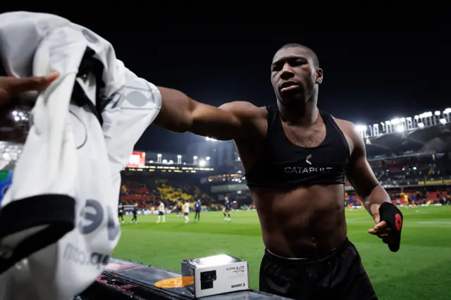 Sinclair Armstrong of Bristol City gives his shirt to the crowd
