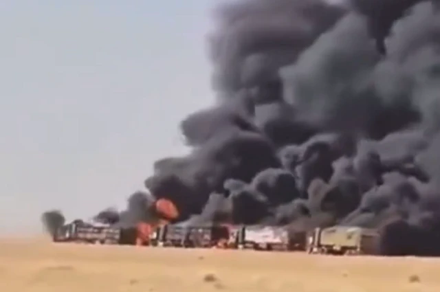 A screenshot showing the convoy of lorries on fire