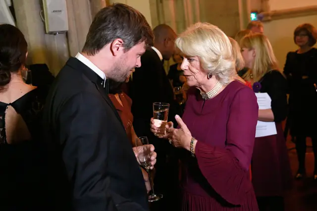David Szalay talking to Queen Camilla