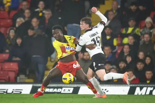 Nestory Irankunda of Watford and George Tanner of Bristol City battle for the ball