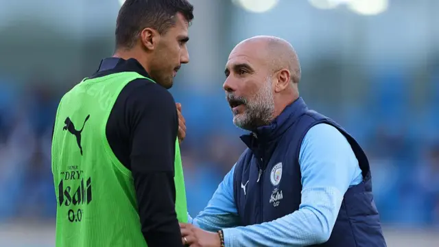 Rodri and Pep Guardiola