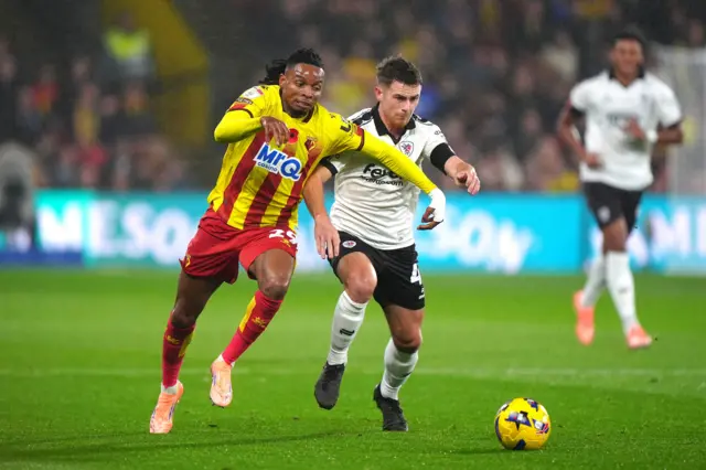 Adam Randell of Bristol City runs with the ball whilst under pressure from Jeremy Petris of Watford