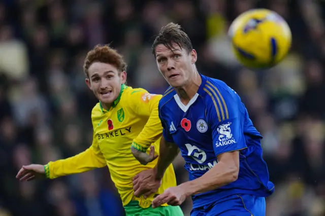 Josh Sargent of Norwich City and Jannik Vestergaard of Leicester City