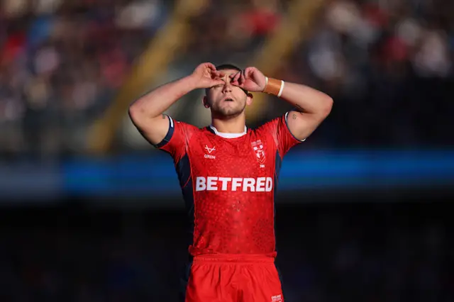 Mikey Lewis looks on