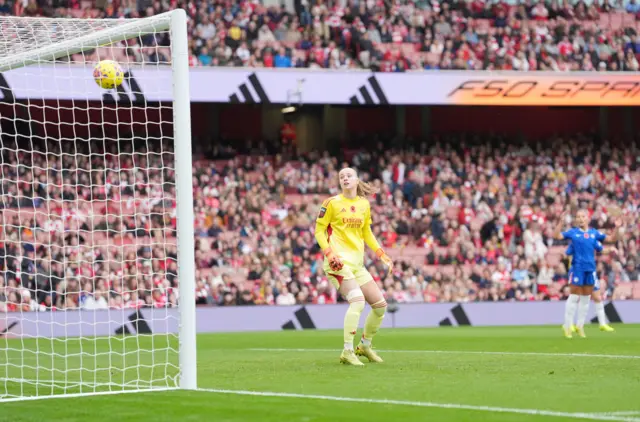 Arsenal Women goalkeeper Daphne van Domselaar watches as Chelsea Women's Alyssa Thompson scores their team's opening goal during the Barclays Women's Super League match at the Emirates Stadium, London.