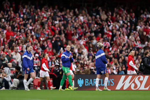 Hannah Hampton of Chelsea acknowledges the fans as she walks out onto the pitch prior to the Barclays Women's Super League match between Arsenal and Chelsea FC at the Emirates Stadium on November 08, 2025 in London, England.