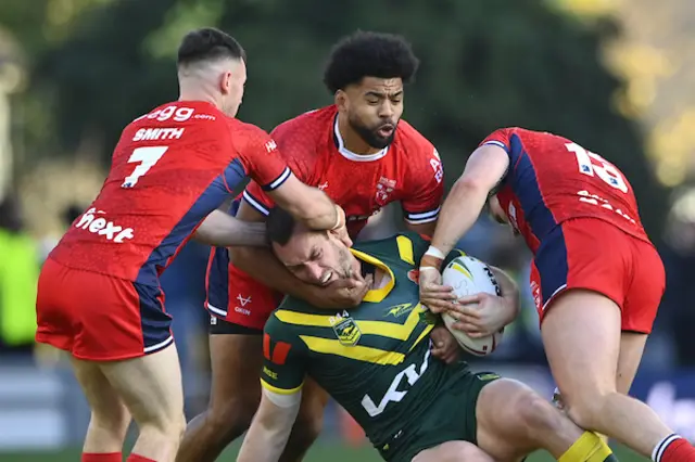 Isaah Yeo of Australia is tackled by Kallum Watkins of England