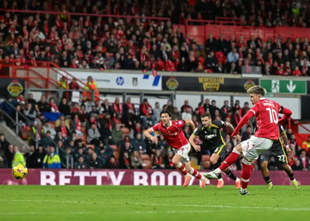 Wrexham’s Josh Windass scores