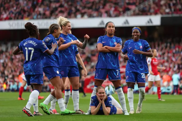 Chelsea players celebrate a goal at the Emirates