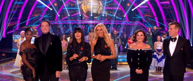 Tess, Claudia and judges lines up on dancefloor on Strictly Come Dancing.