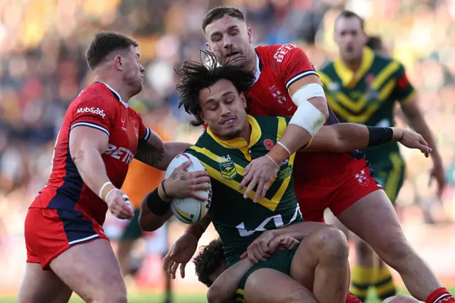 Australia's Tino Fa'asuamaleaui is tackled