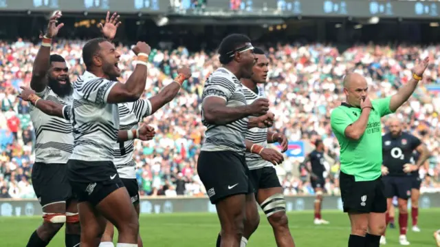 Fiji celebrate winning at Twickenham in 2023