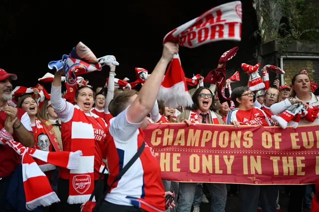 Arsenal fans arrive at the stadium